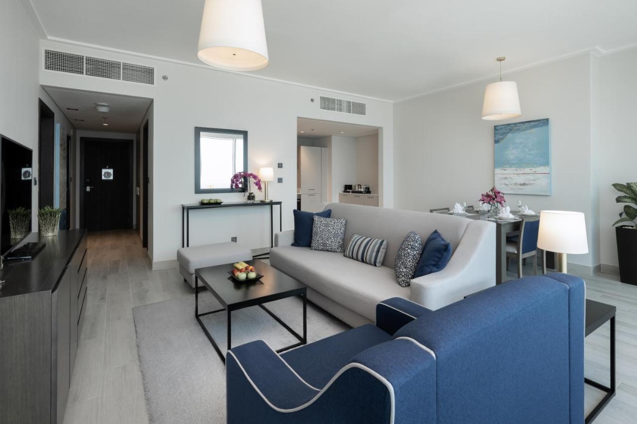 Centara West Bay Hotel & Residences Ad Dawhah Esterno foto A living room at the Address Downtown Hotel
